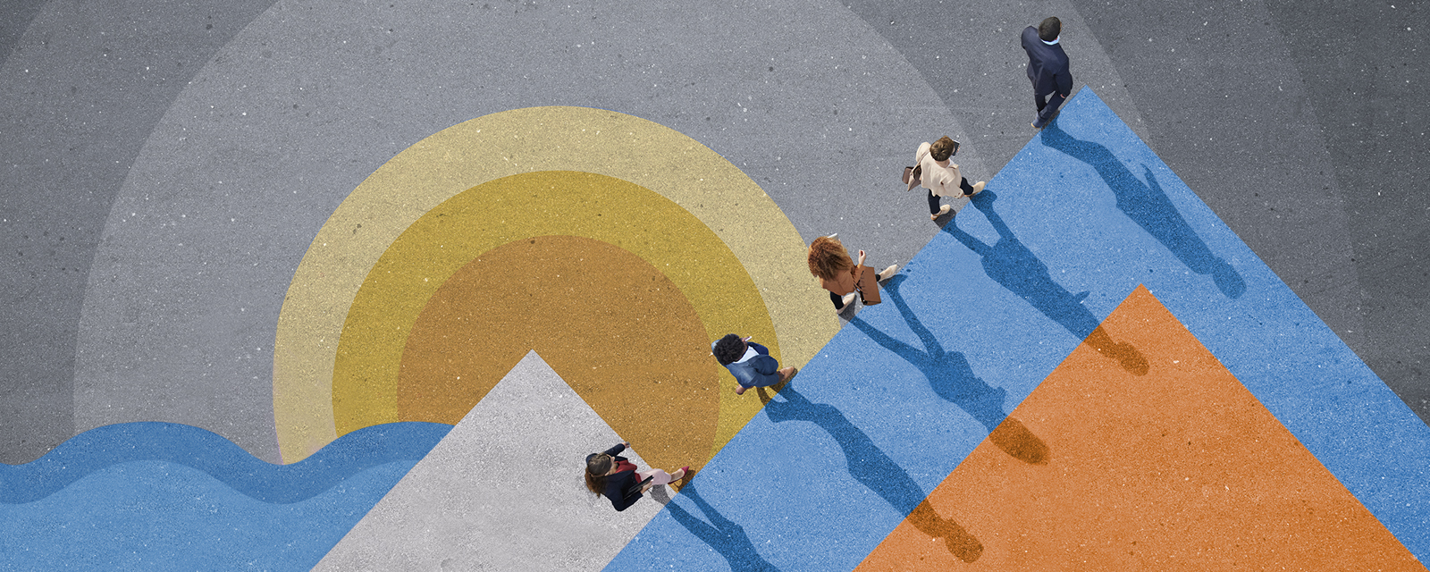 An overhead shot of 5 people walking in a line on a colorful background.